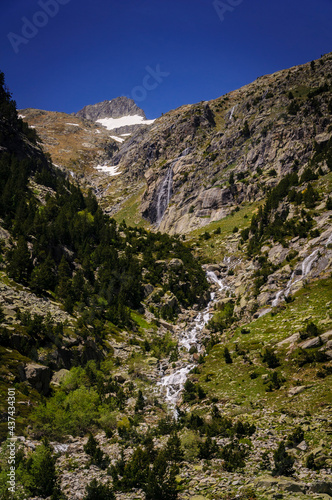 Ravines above the Cavallers reservoir, with the Besiberri Nord summit in the background (Boí Valley, PN AIgüestortes and Sant Maurici, Catalonia, Spain, Pyrenees)