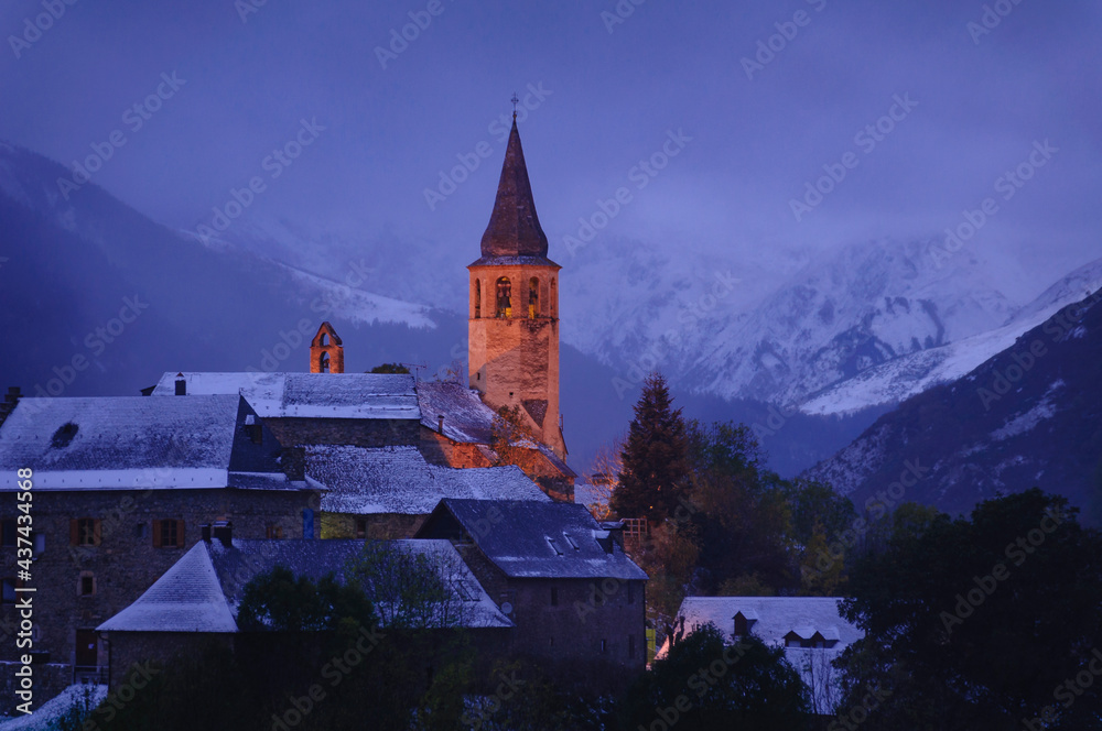 Santa Eulària d'Unha bell tower after a light autumn snowfall (Aran Valley, Catalonia, Pyrenees, Spain)