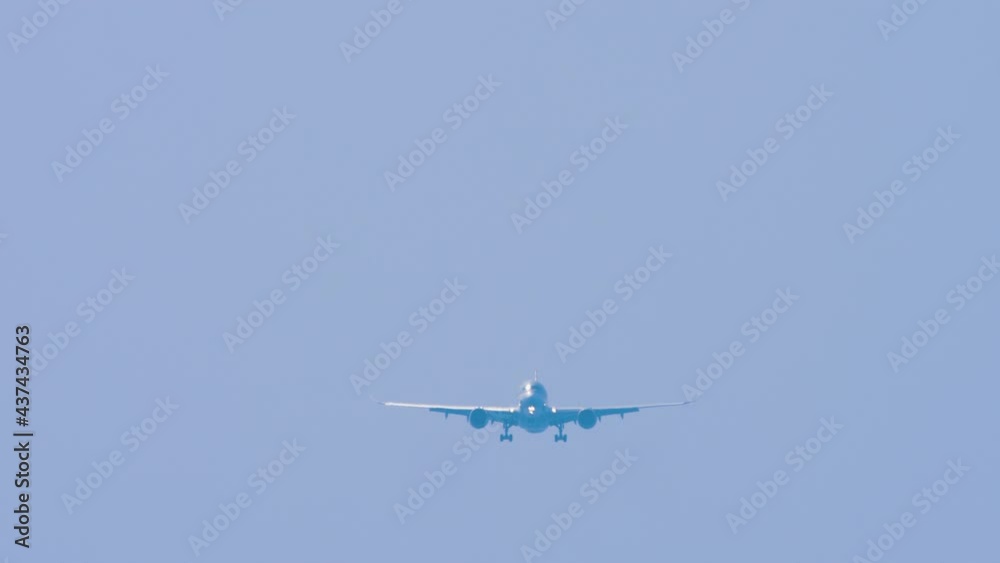 Passenger plane descends for landing Passenger plane descends for landing