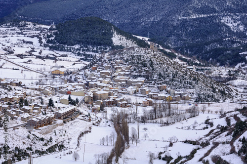 Snowy village of Gósol in winter, seen from the Coll de Josa (Berguedà, Catalonia, Spain, Pyrenees)
