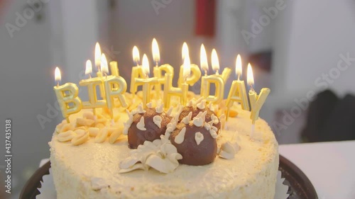 4K Burning candles in birthday cake. Colorful candles flame in homemade Sweet dessert for birthday party. Birthday candles for home party
