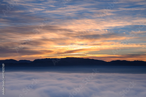 Sunrise with a sea of clouds over the Sau Reservoir seen from Roca del Migdia summit (Collsacabra, Catalonia, Spain) © Sergi_Boixader