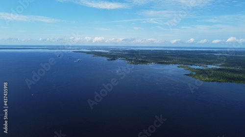 Aerial view of Negro river and Amazon rainforest  near the city of Manaus  Amazonas state  Brazil.