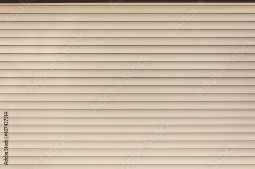 Photography White siding wall as an abstract background.