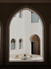 Modern east style building with beige walls, windows and sunlight shadows. Abstract architecture facade design concept background