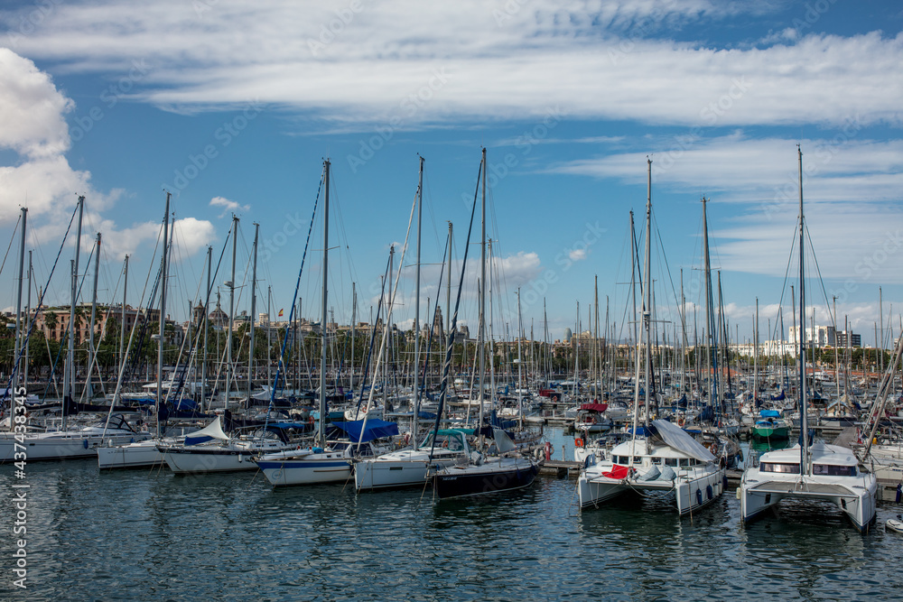 Sailing boat parking on the shore of Barcelona, summer background