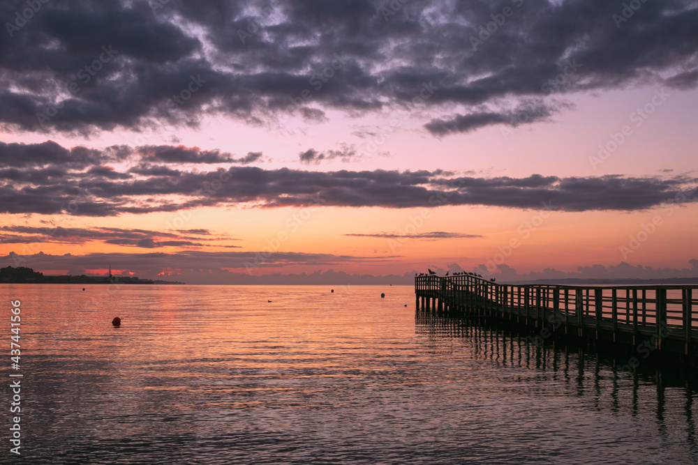 Fototapeta premium jetty by the sea at dawn
