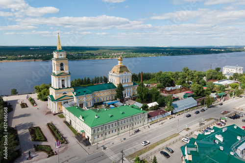Aerial view of Perm and historical building of art gallery, Kama river with bridge in sunny summer day with green trees