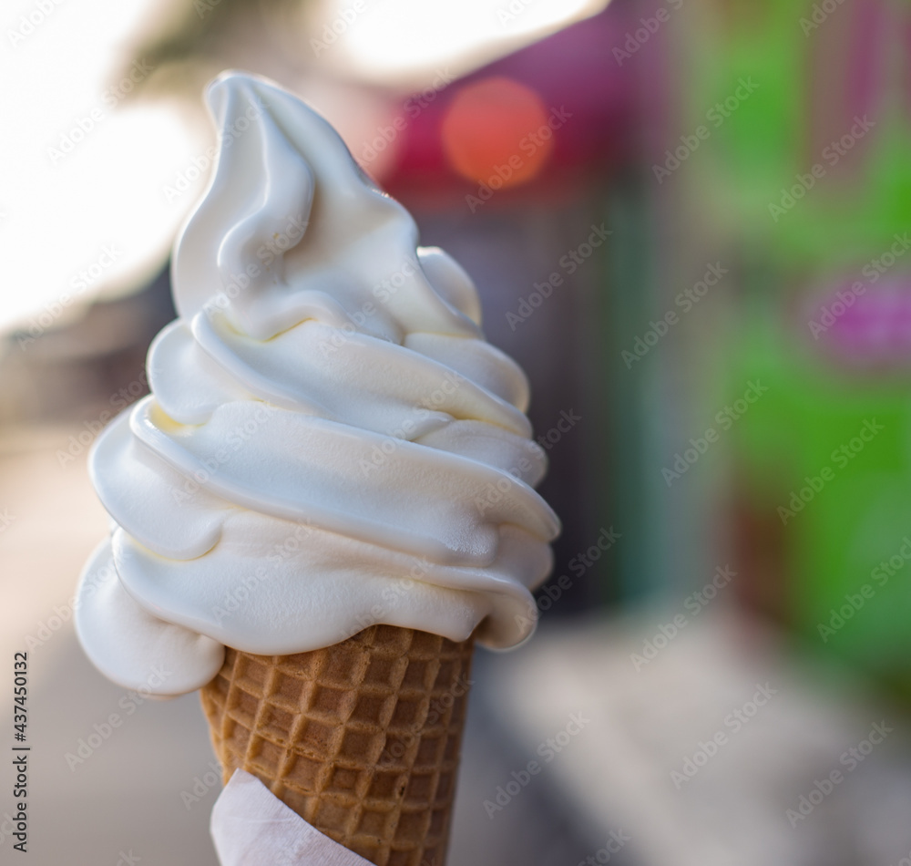 soft serve vanilla ice cream cone stock photo with a boardwalk ...