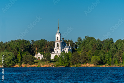 Old Orthodox Temple of Ascension by the river in the forest. © Andrey Nikitin