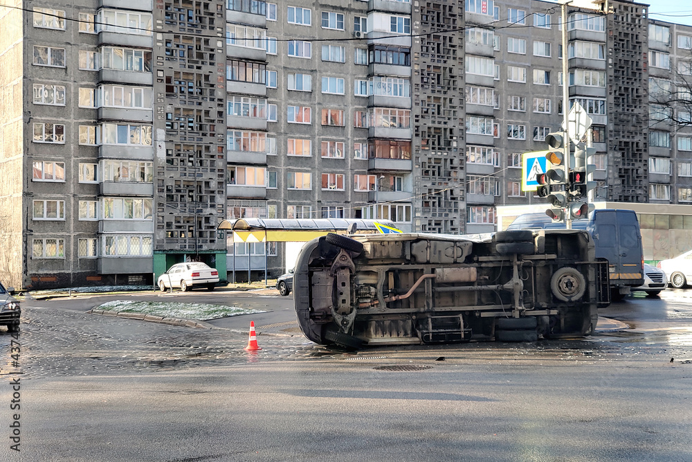 overturned car on a city street
