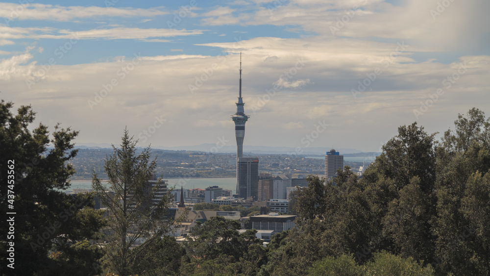 Auckland Panorama with the Harbour, Stanley Bay and the TV Tower. City Skyline on a Cloudy Sky Background. New Zealand.  View from Stanley Point.