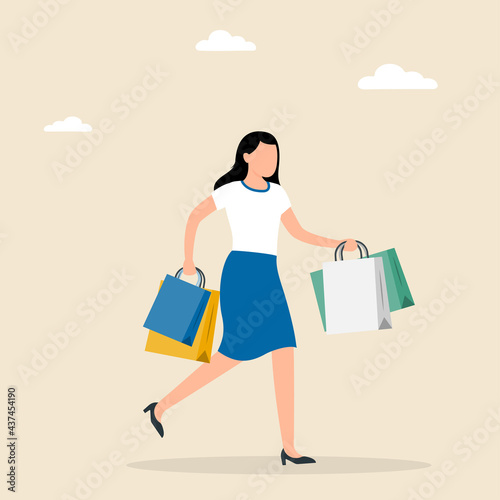 Shopping woman holds packages from the store in her hands.