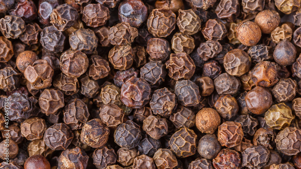 Large pile of allspice peas. Food background.Background made of middle eastern traditional spice . Top view.Textures of colorful spices and condiments.