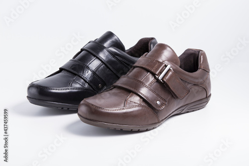 Male black and brown leather shoes on white background, isolated product.