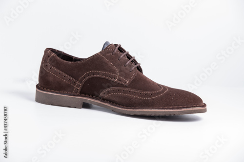 Male brown leather elegant shoe on white background, isolated product, comfortable footwear. © GeorgeVieiraSilva