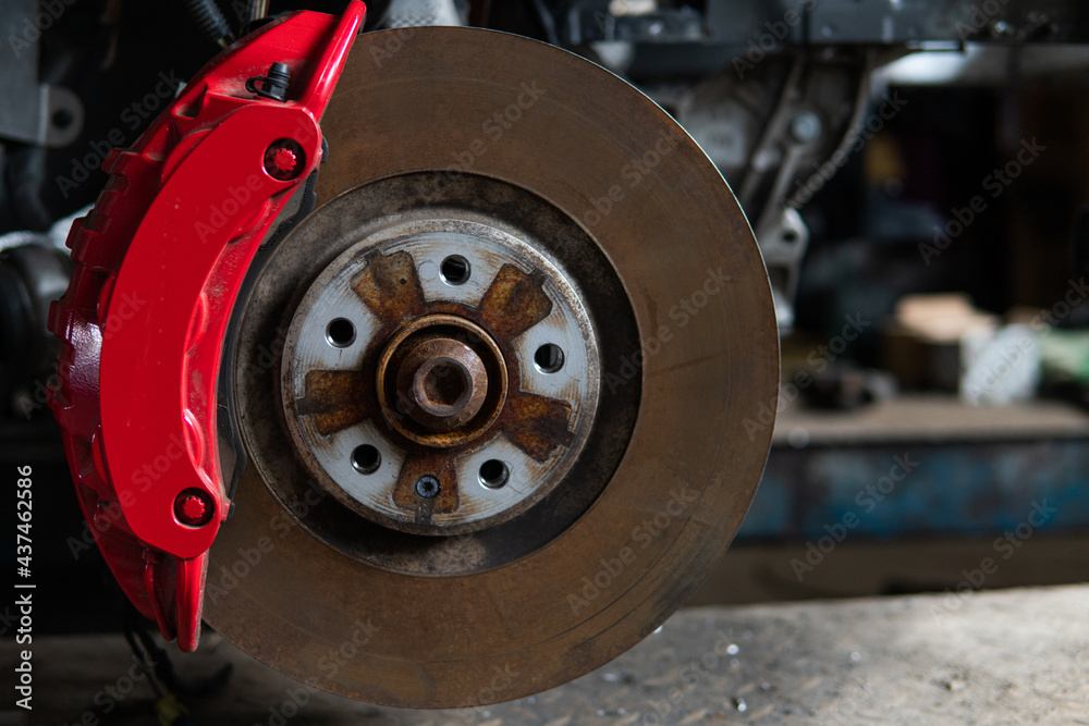 car under repair brake disc and caliper