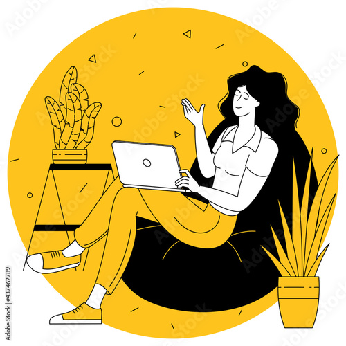 woman with a laptop on a sofa