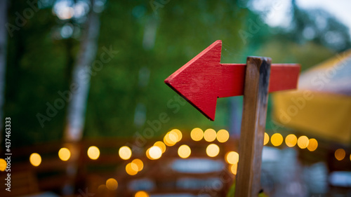 red signpost arrow bokeh background