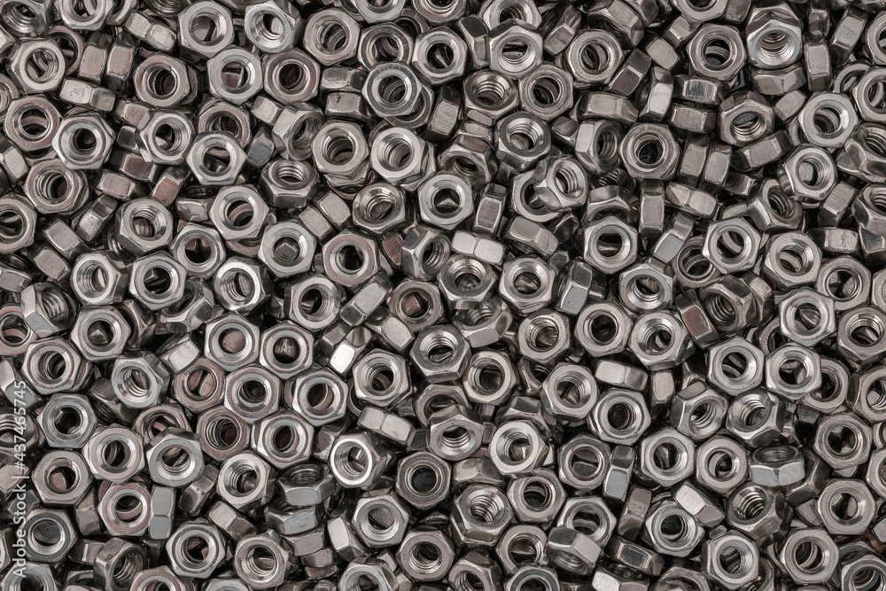 Stainless steel nuts background macro photo. Stainless steel nuts background macro photo.
