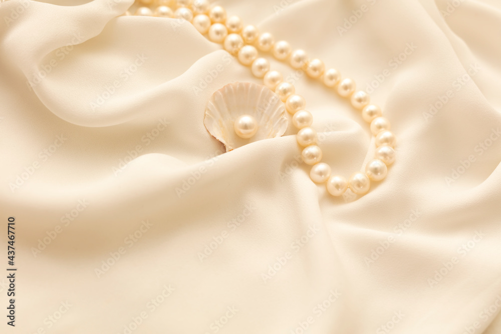 A pearl necklace against white background A pearl necklace against white background