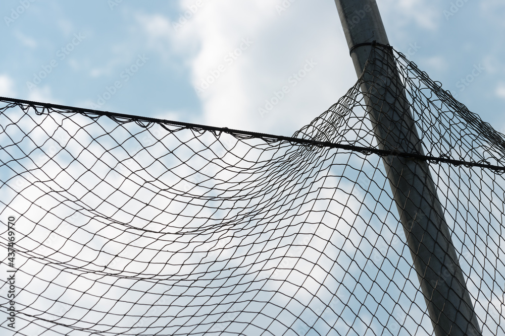 nylon netting fence against blue sky nylon netting fence against blue sky