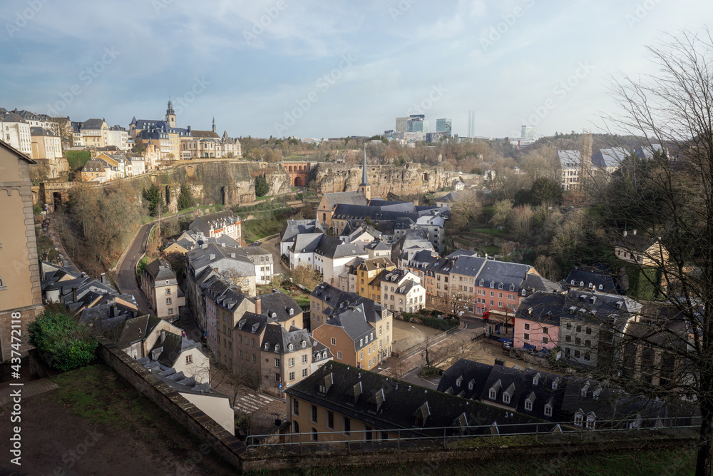 Luxembourg city skyline - Aerial view of The Grund at night with St Michaels Church on background - Luxembourg City, Luxembourg