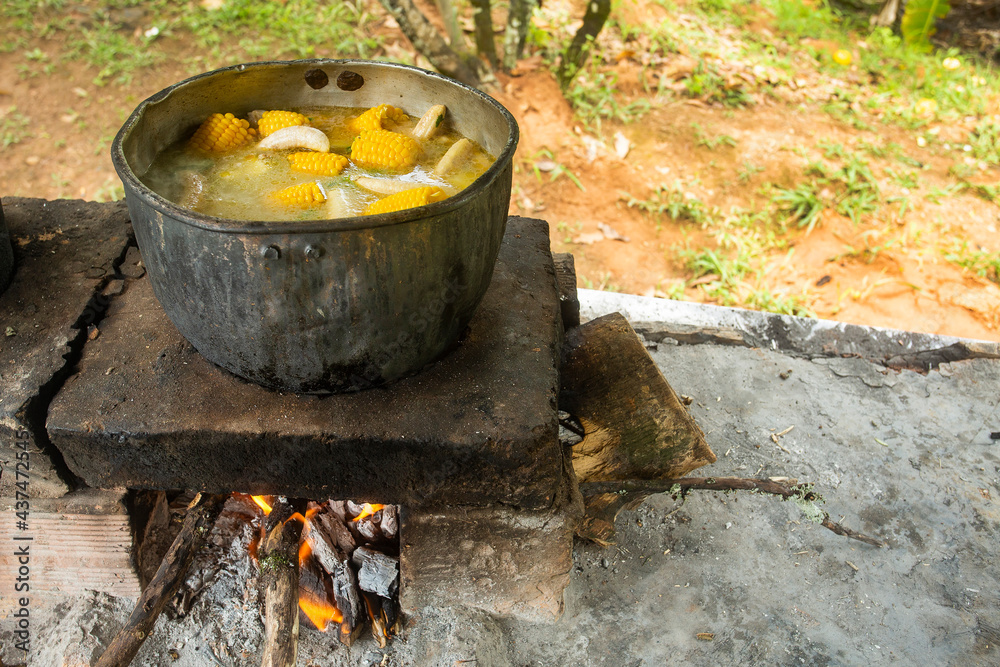 Chicken stew, typical Colombian dish on a wood stove Chicken stew, typical Colombian dish on a wood stove