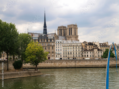 The river Seine in Paris in summer with the Notre Dame cathedral in the background. Image for tourism 