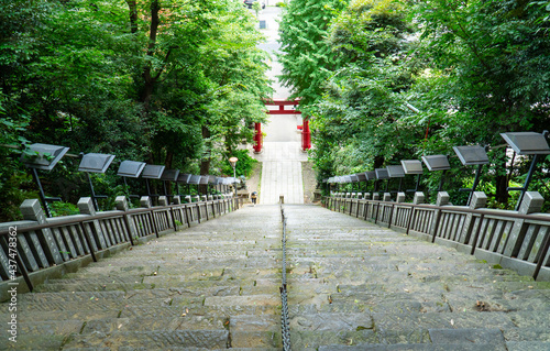 Look-down steep stairs and high stepping leading to Atago Shrine(Japanese Character, public place), Tokyo Japan. Presented concept, hardness, difficulty, patient, no giving up, obstacle and challenge. photo
