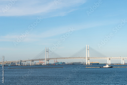 Exterior architecture and view of Yokohama bridge and Yokohama bay on the blue sky day. Yokohama is one of tourist destination place in visiting Japan and landmark for business and industrial in Kanto