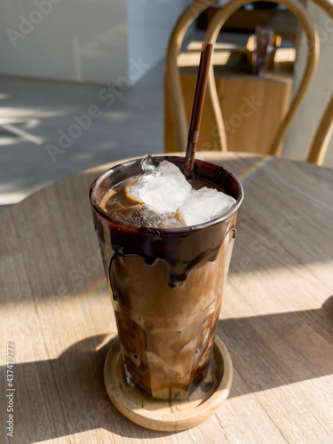 Iced mocha on wooden table photo