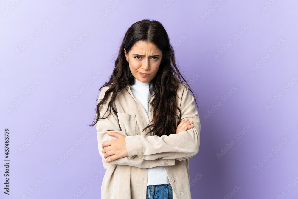 Young caucasian woman isolated on purple background feeling upset Young caucasian woman isolated on purple background feeling upset