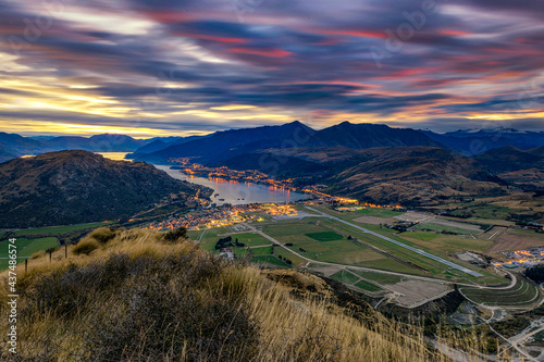Scenic view of Queenstown City and Airport at Sunset, New Zealand photo