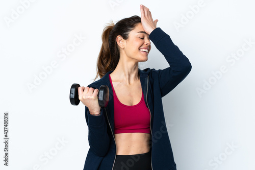 Sport woman making weightlifting over isolated white background has realized something and intending the solution
