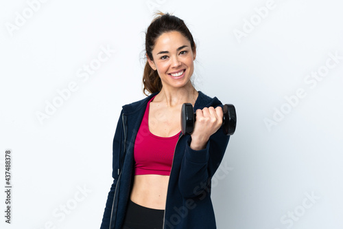 Sport woman making weightlifting over isolated white background with happy expression