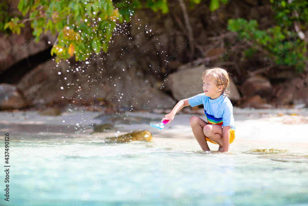 Kids playing on beach. Children play at sea. Kids playing on beach. Children play at sea.