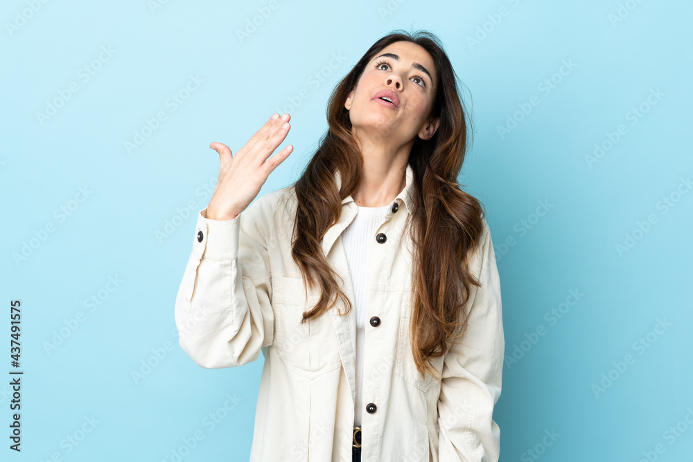 Woman over isolated background with tired and sick expression Woman over isolated background with tired and sick expression