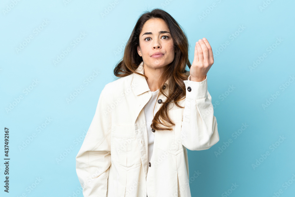 Woman over isolated background making Italian gesture Woman over isolated background making Italian gesture