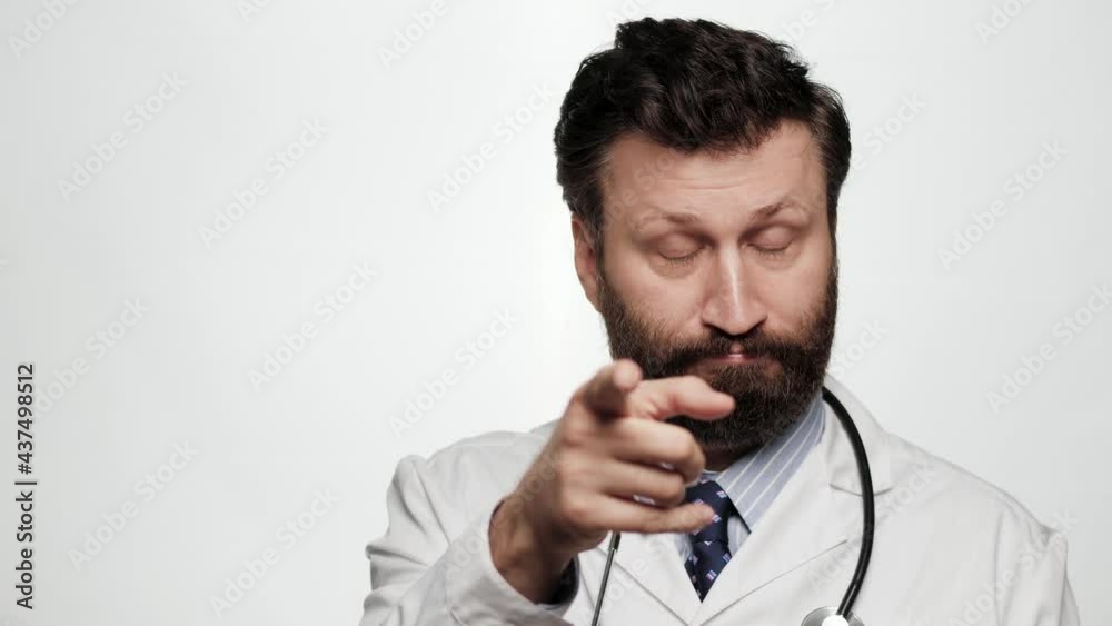 Doctor just think gesture emotion. Positive man doctor on white background looking at camera and tapping his finger on his temple, suggests thinking well Doctor just think gesture emotion. Positive man doctor on white background looking at camera and tapping his finger on his temple, suggests thinking well