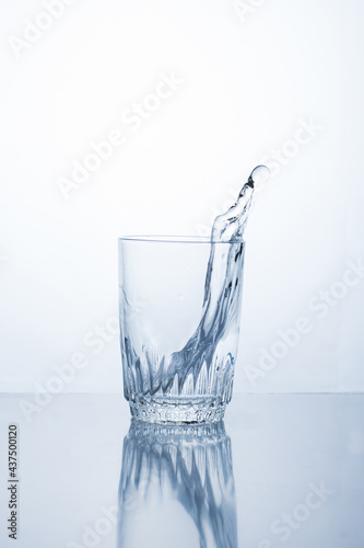 Alcoholic drink or water in a glass, splash, splash.