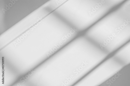 Abstract shadow and striped diagonal light blur background on white wall from window, effect overlay