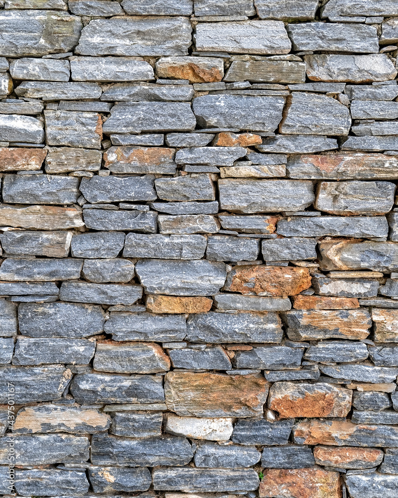 Fototapeta premium colorful slate stone wall closeup, natural, seamless pattern