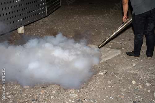 Man worker fogging insecticide to eliminate mosquito for preventing spread dengue fever and zika virus.