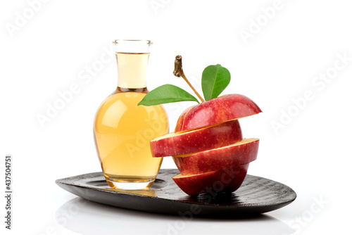 Fotografía Apple fruit and apple cider vinegar isolated on white background.