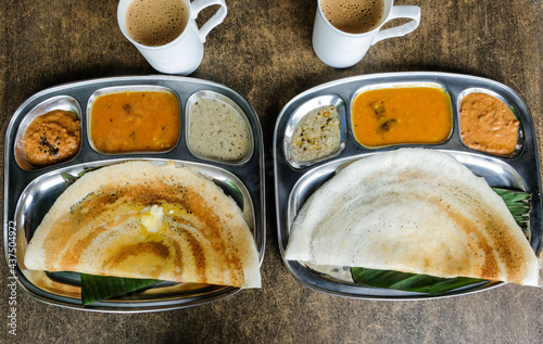 Popular Southern Indian Cuisine / Butter and Plain Dosa with Masala Tea / Delicious thin and crispy crepe-like pancake goes well with various chutnies, igli podi and ever popular masala tea