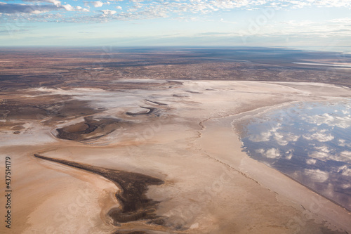 Aerial view of the coastline of Kati Thunda, Lake Eyre, Australias largest salt lake showing salt lines along the shore at Halligan Bay created by the flood waters. photo