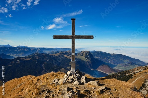 summit cross on the zindlenspitz in between the glarus and schwyzer mountains. Summit in the innerthal. Wagitalersee