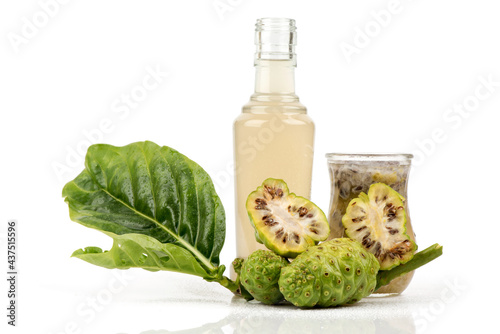 Noni fruits ,green leaves and juice fruits isolated on white background. photo