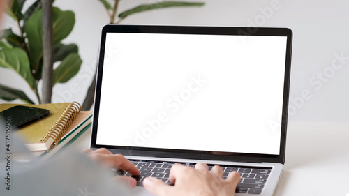 Laptop computer screen mockup, template background, Man hand typing laptop computer with blank screen, Business online, e commerce, online study concept photo